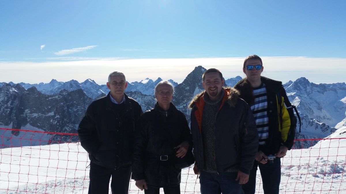 Snowvision team meeting_with_Les_2_Alpes_resort, standing outside I the snow on a mountain