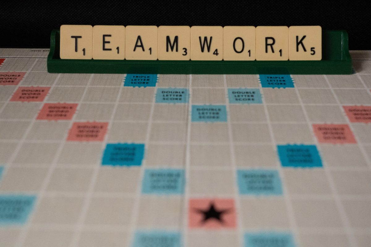 Scrabble: Written word: TEAMWORK