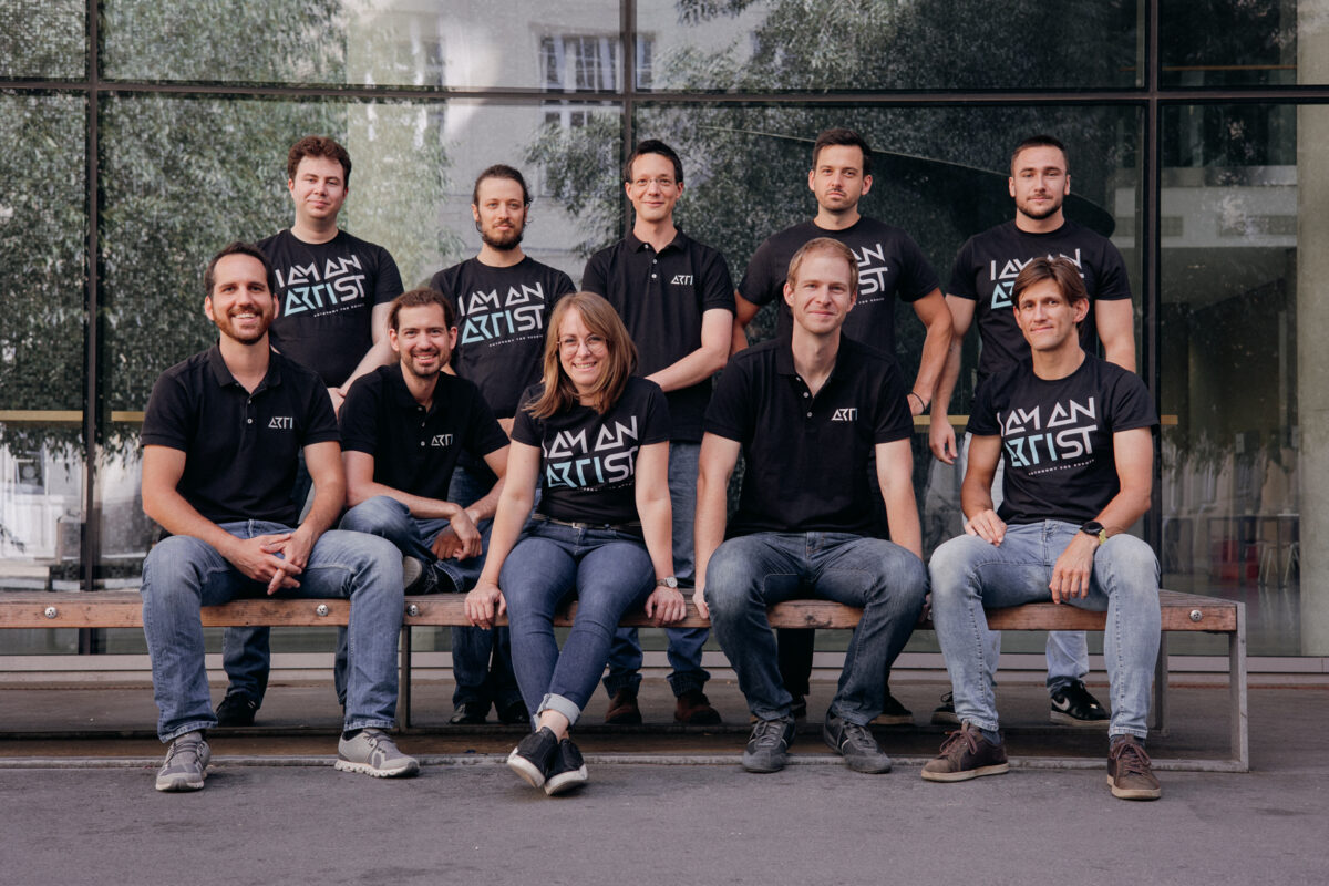 10 people sitting on a bench in front of a building